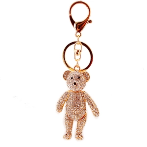 Gold crystal bear keychain with sparkling rhinestones and metal hook on white background