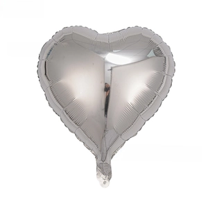 Macro view of 18 inch heart shaped silver foil balloon with mirror metallic finish