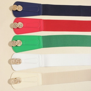 Detail of five elastic wide belts in navy, red, green, white, and beige with gold buckles