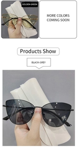 Detail view of golden-green and black-grey cat eye sunglasses with metal frames