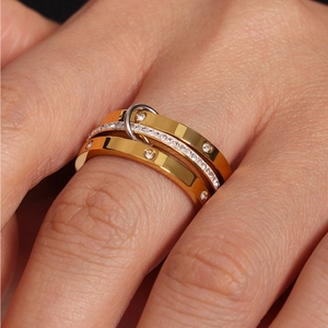 Three-layer interlocking ring set in gold and silver finish with crystal inlay