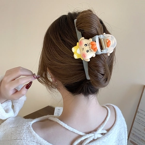 Cute cartoon character hair claw clip in a stylish updo on soft blue matte finish