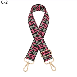 Adjustable geometric ethnic style bag strap with pink triangles and gold metal hooks