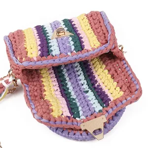 Handmade colorful crochet crossbody bag with striped yarn pattern and gold metal clasp