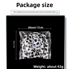 Package dimensions of black and white polka dot headband showing 17cm x 15cm size