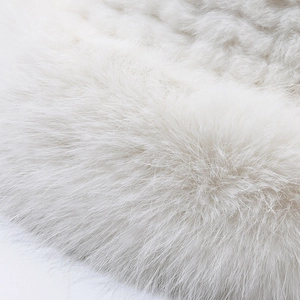 Close-up of fluffy white faux fur texture on a warm winter Lei Feng bucket hat