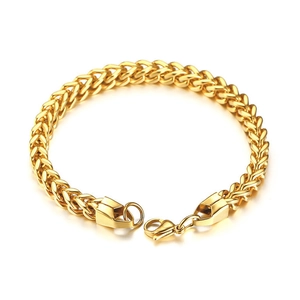 Detailed macro shot of golden Franco chain showing polished stainless steel weave textures