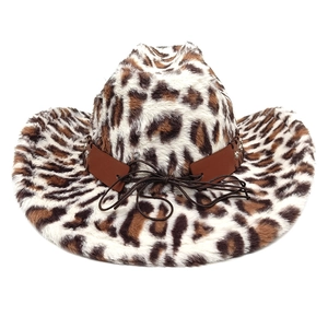 Close-up of leopard print faux fur texture and brown leather band with metal rivets