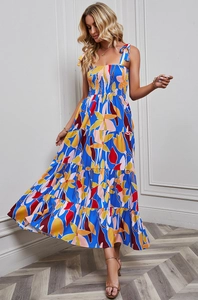 Detail of tropical floral maxi dress showing tie-up straps and elastic smocked bodice