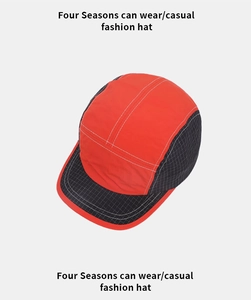 Detail view of quick-dry color-block baseball cap with contrast stitching and mesh texture