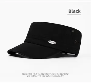 Detail view of washed black flat top army cap with metallic logo and breathable eyelets