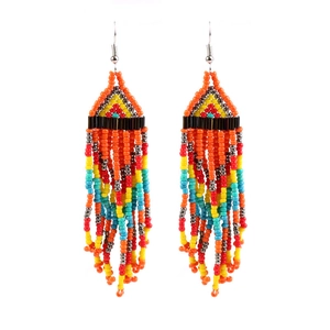 Detail shot of bohemian handmade seed bead tassel earrings with vibrant multicolor fringe