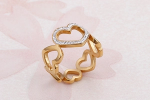 Macro shot of 18K gold plated heart ring with pavé cubic zirconia and cutout design
