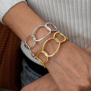 Irregular geometric chain bracelets in gold and silver finish for a modern minimalist look