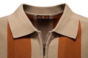 Macro detail of men's knitted polo collar with silver zipper and vertical stripes