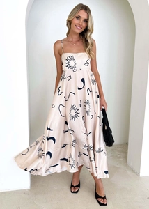 Chic satin maxi dress with spaghetti straps and black abstract celestial sun prints