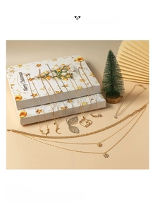 Exquisite Christmas advent calendar jewelry set with assorted pendants in a festive gift box