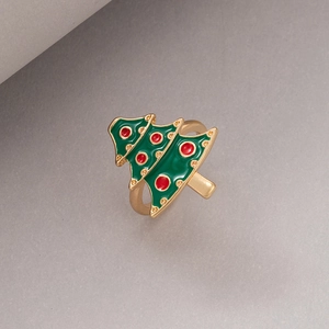 Detailed close-up of Christmas tree ring with green and red enamel on golden alloy base