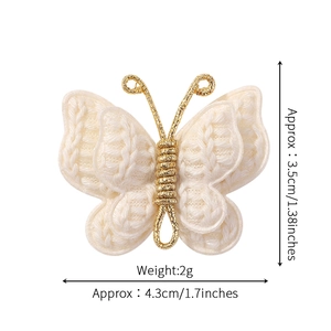 Handmade crochet butterfly hair clip in cream white with gold wire details for kids