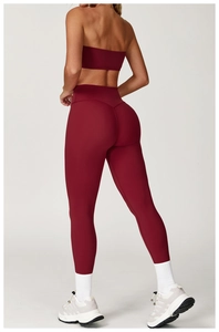 Rear view of dark red yoga set showing high waist leggings with butt-lifting seams