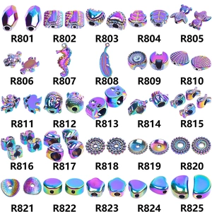 Macro detail of electroplated iridescent crystal pendants in 25 assorted charm shapes