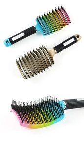 Close-up of colorful curved vent hairbrushes with nylon bristles and ergonomic handles