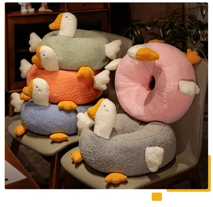 Detailed close-up of colorful goose plush seat cushions in soft teddy fleece material