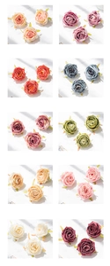 Macro shot of assorted silk artificial rose heads in vibrant colors for DIY wedding decor