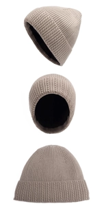 Detail of beige knit beanie showing thick black fleece lining and textured cable pattern