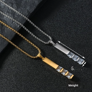 Detailed macro view of square zircon pendant on stainless steel box chain necklace