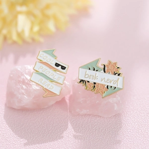 Cool People Read book nerd metal enamel pin set with gold trim on pink crystal base