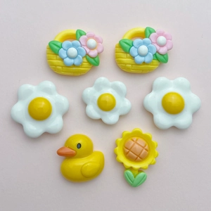 7-piece DIY resin charm set with yellow duck, sunflower, egg, and flower baskets