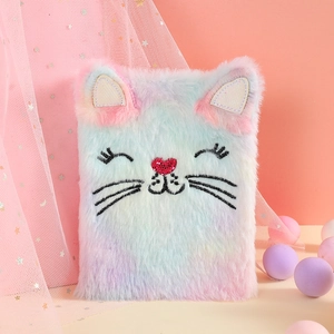 Macro view of plush rainbow cat notebook with glitter ears and heart nose detail