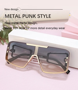 Detail of Y2K metal punk sunglasses with gold frame and brown gradient lenses