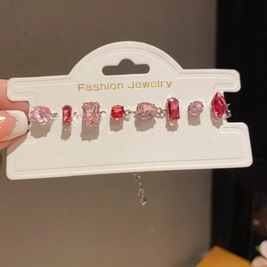 Detailed view of the multi-colored gemstone bracelet with sparkling crystals and silver chain