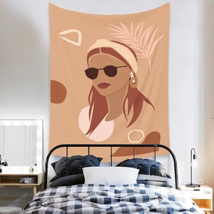 Abstract woman portrait tapestry hanging above a bedroom headboard for wall decor