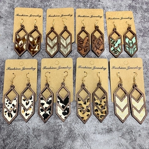 Set of 8 pairs of geometric wooden drop earrings with animal and feather patterns