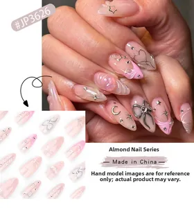 Pink almond press-on nails with 3D bows and silver stars detail showing on hands