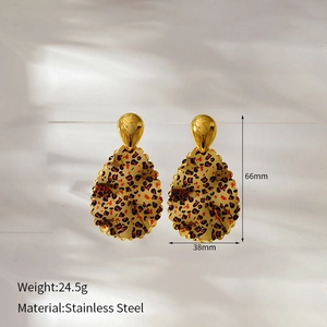 Detail shot of leopard print teardrop earrings in gold-plated stainless steel