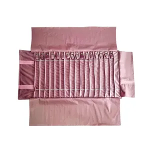 Pink velvet jewelry roll organizer with 20 necklace slots and secure metal buckle