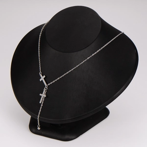 Minimalist silver stainless steel cross tassel Y-necklace on black mannequin neck