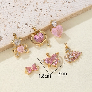 Pink zircon and gold pendant set with bear, heart, and swan designs for DIY jewelry