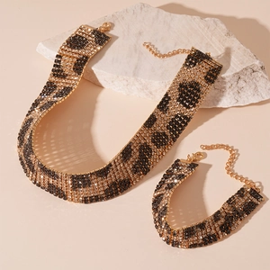 Sparkling leopard print rhinestone choker and bracelet set with gold finish on stone