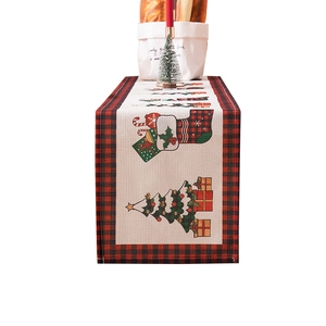Modern Christmas tree table runner with red plaid borders and festive holiday patterns