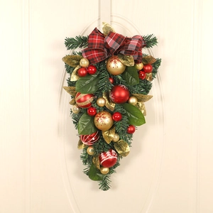 Detail of Christmas PVC teardrop wreath with pine needles, colorful balls and plaid bow