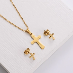 Polished gold titanium steel jewelry set featuring cross necklace and matching stud earrings