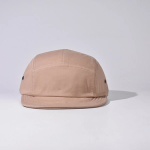 Detail view of khaki 5-panel camper hat with metal eyelets and flat brim design