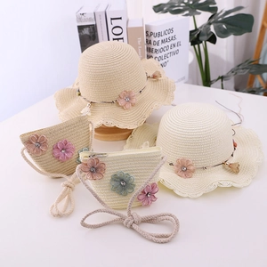 Kids straw sun hat and matching bag set with floral decor for beach outings