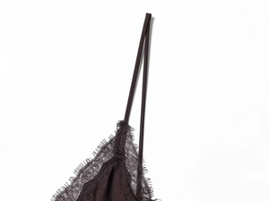 Close-up of black satin midi dress featuring delicate eyelash lace trim and thin straps