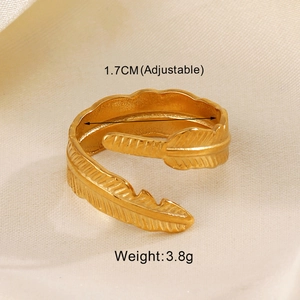 Macro shot of gold feather open ring with 1.7cm adjustable diameter and 3.8g weight
